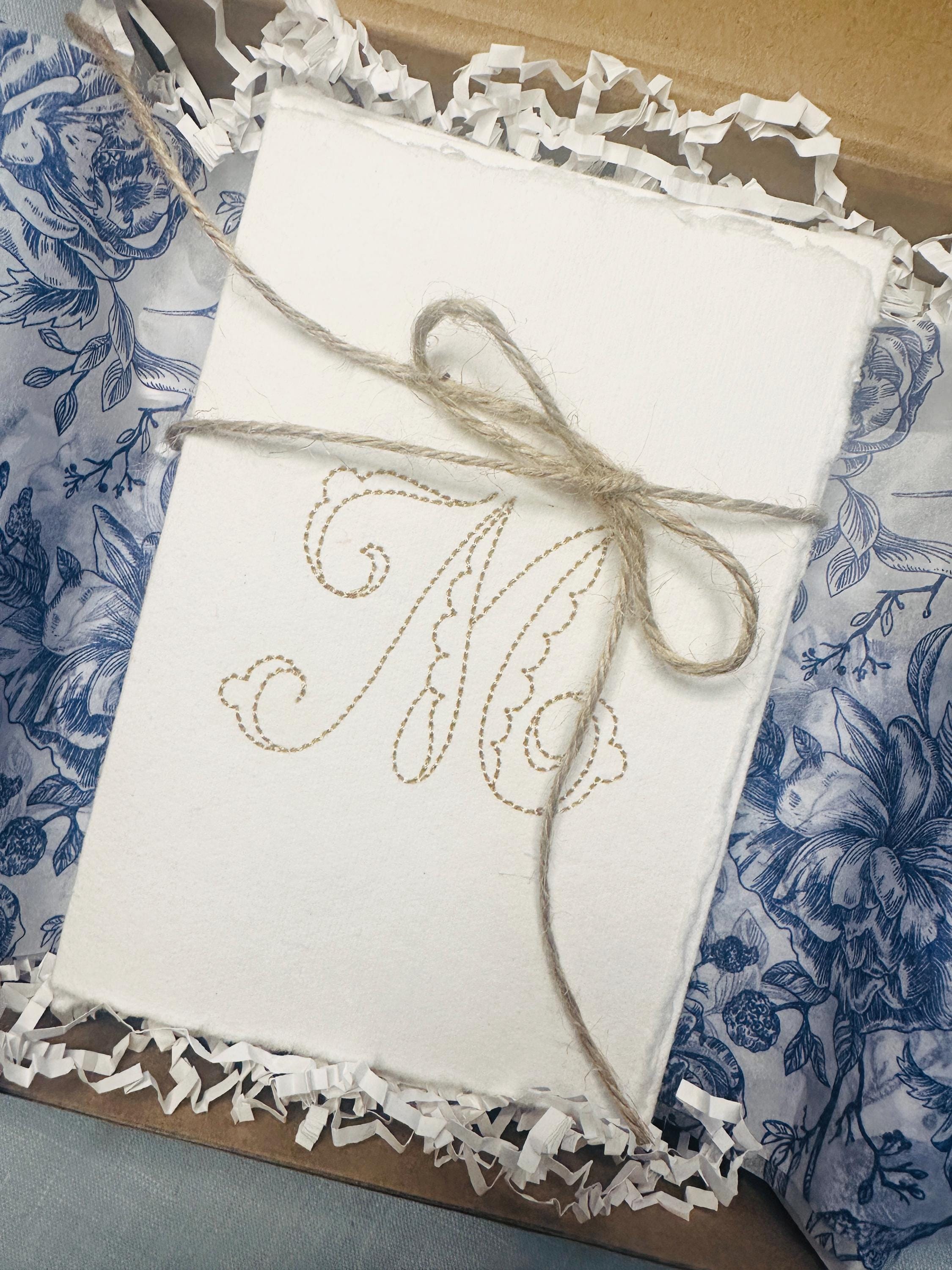 Handmade Embroidered Monogram M on Recycled Handmade Paper Stationary tied with jute and in a box with chinoiserie blue and white tissue.