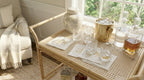 Wicker bar cart with drinks and decor in a home setting