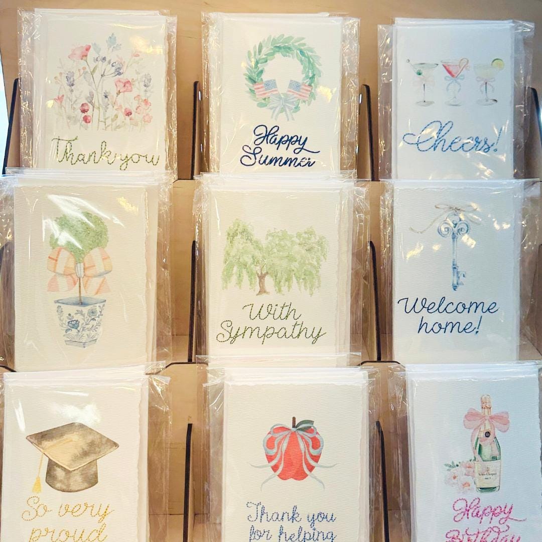 A photo of 9 different handmade cards that our shop offers.